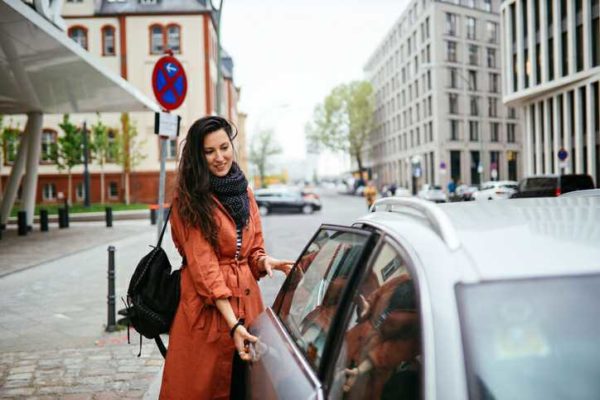Student getting into a Taxi